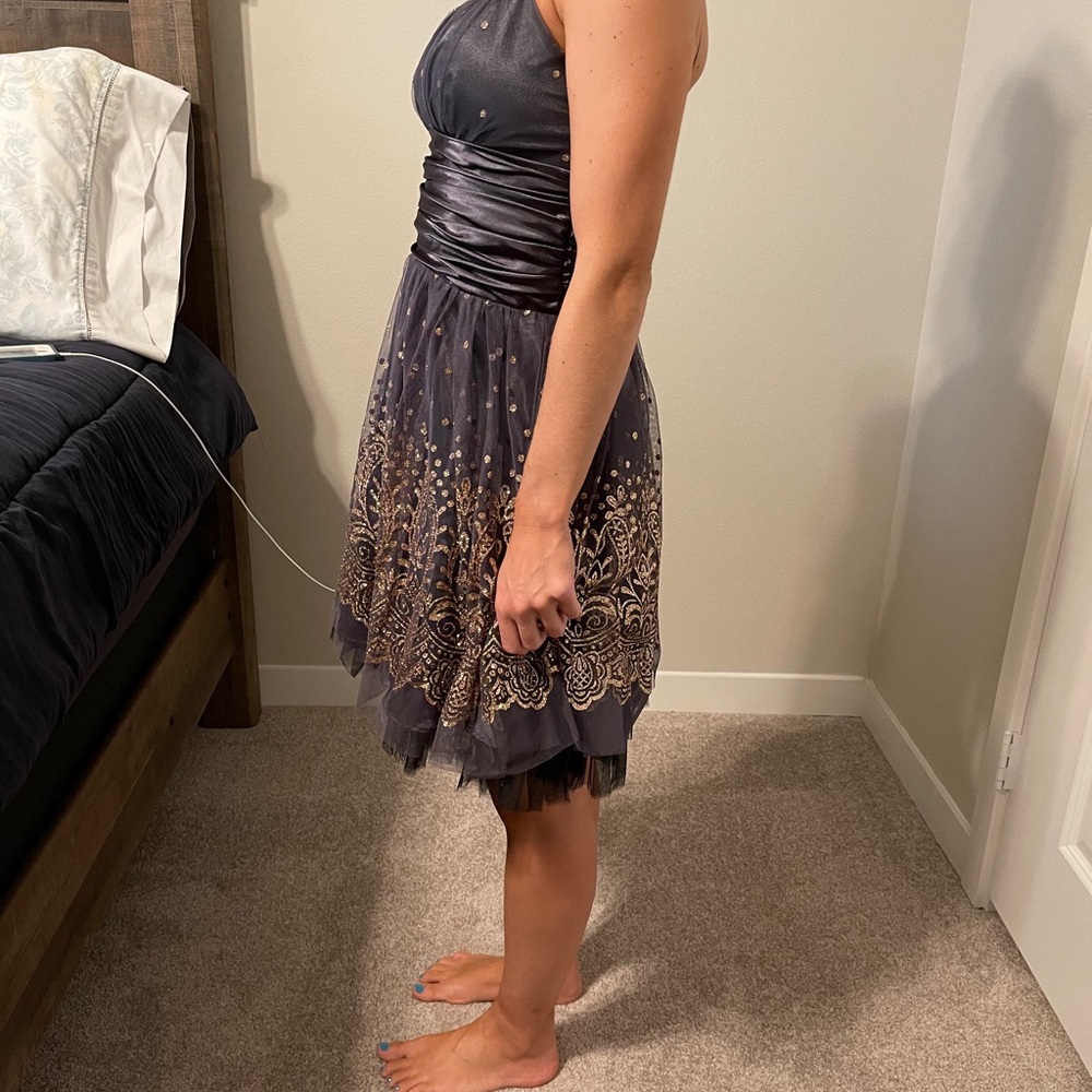 Grey spaghetti strap dress with gold detailing.